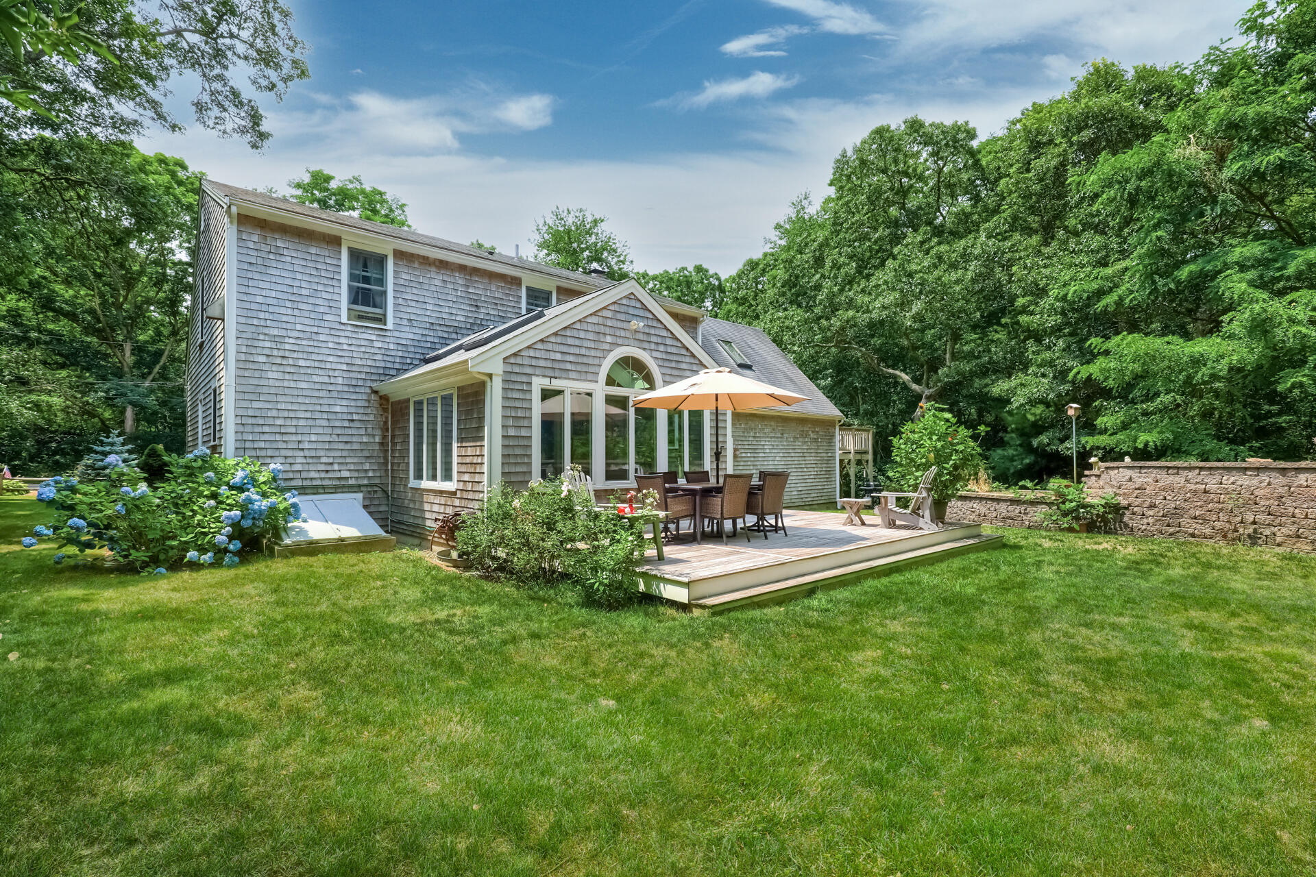 626 River Road Marstons Mills, MA 02648 - Photo 22 of 27 a front view of house with yard and green space