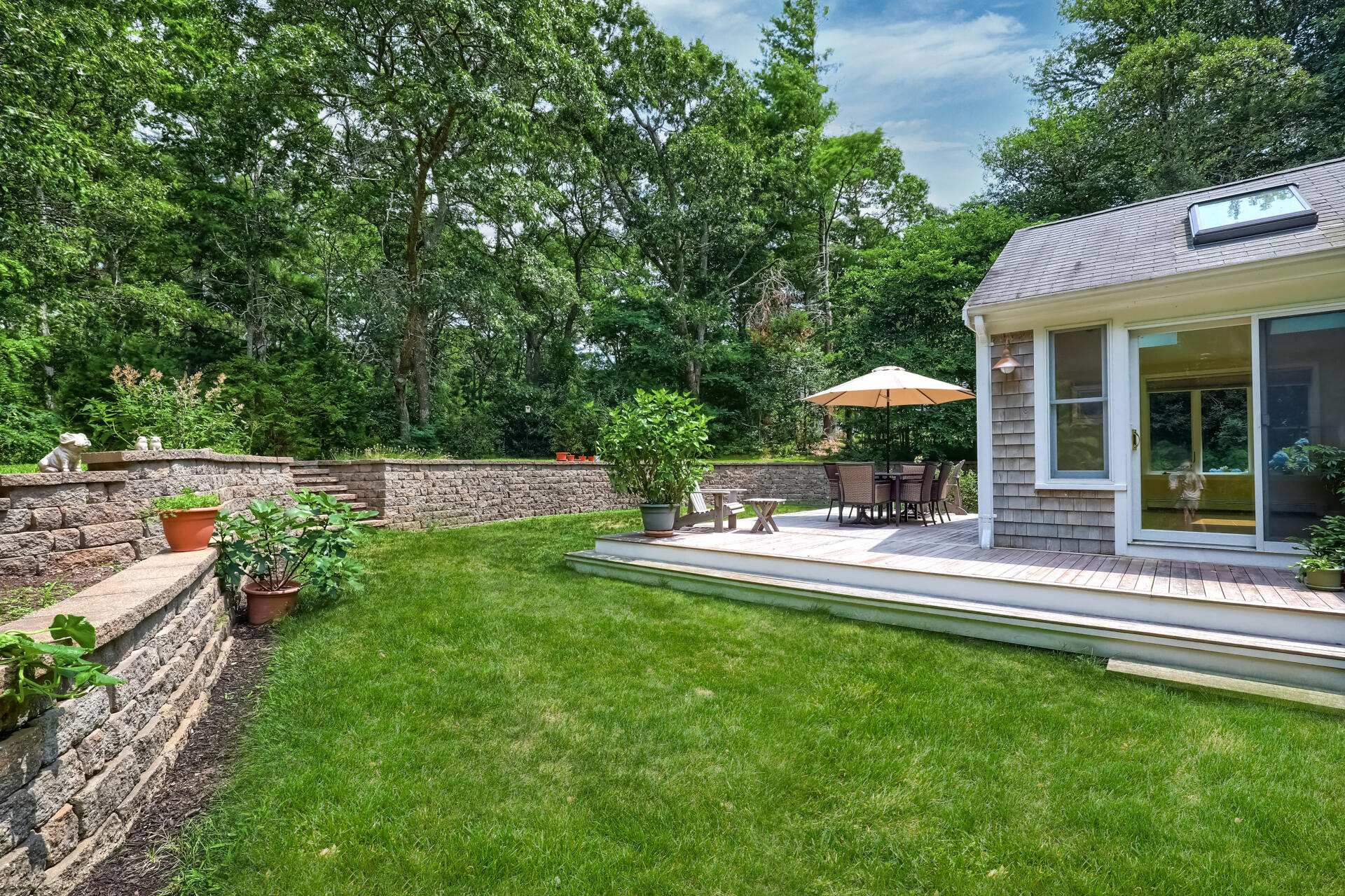 626 River Road Marstons Mills, MA 02648 - Photo 23 of 27 a view of house with backyard and outdoor seating