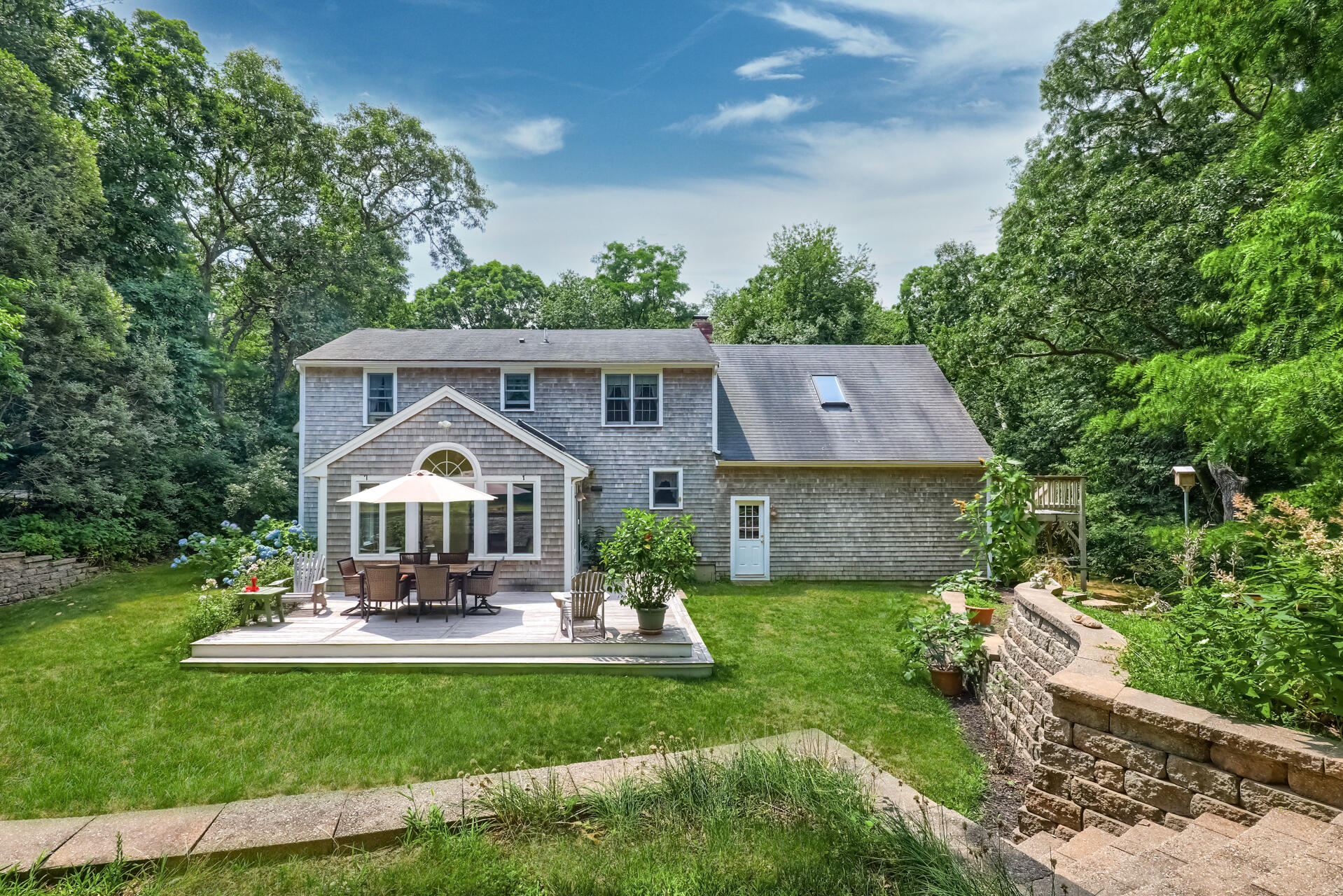 626 River Road Marstons Mills, MA 02648 - Photo 24 of 27 a front view of a house with garden