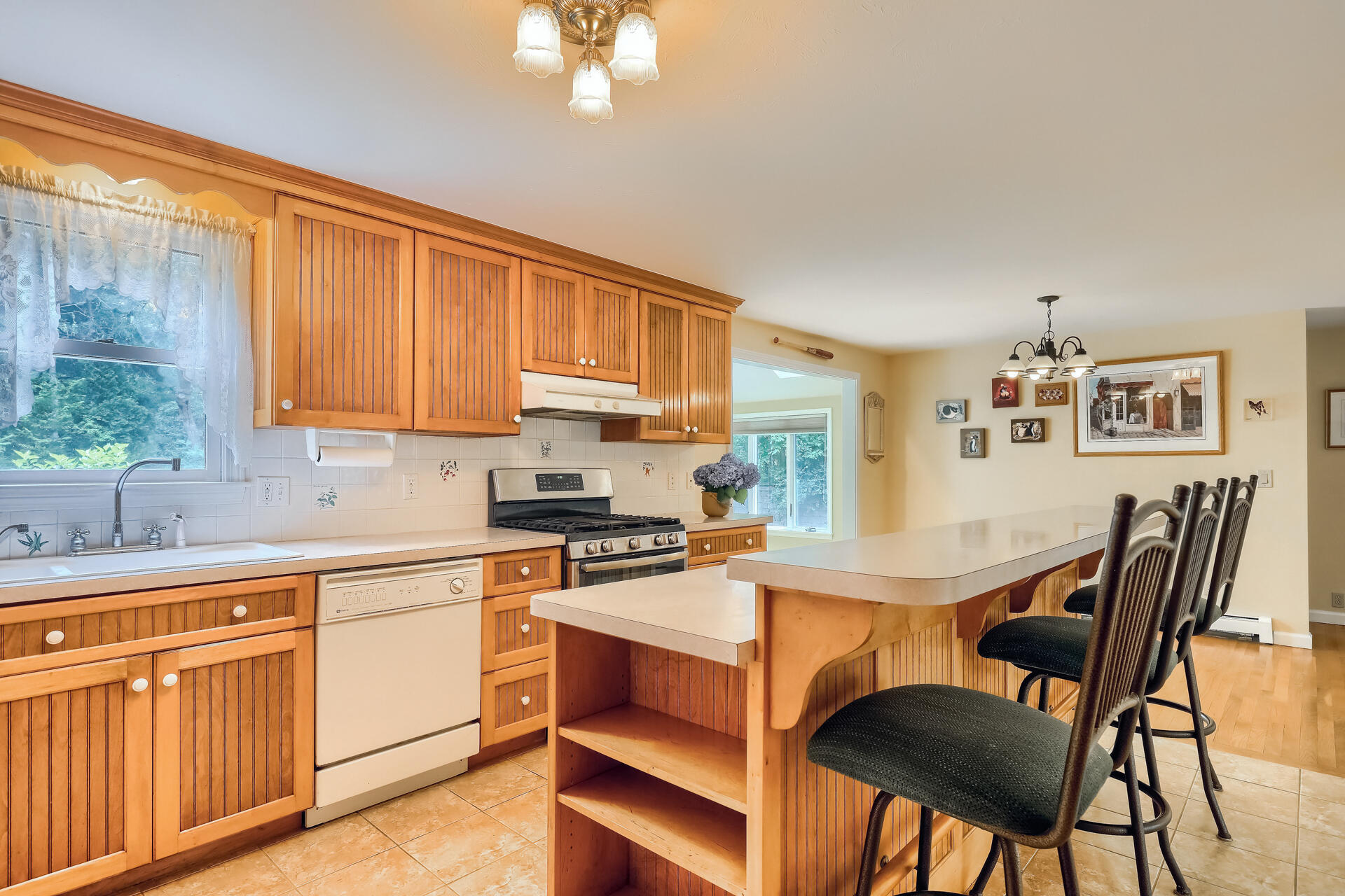 626 River Road Marstons Mills, MA 02648 - Photo 6 of 27 a kitchen with stainless steel appliances granite countertop a table chairs sink and cabinets