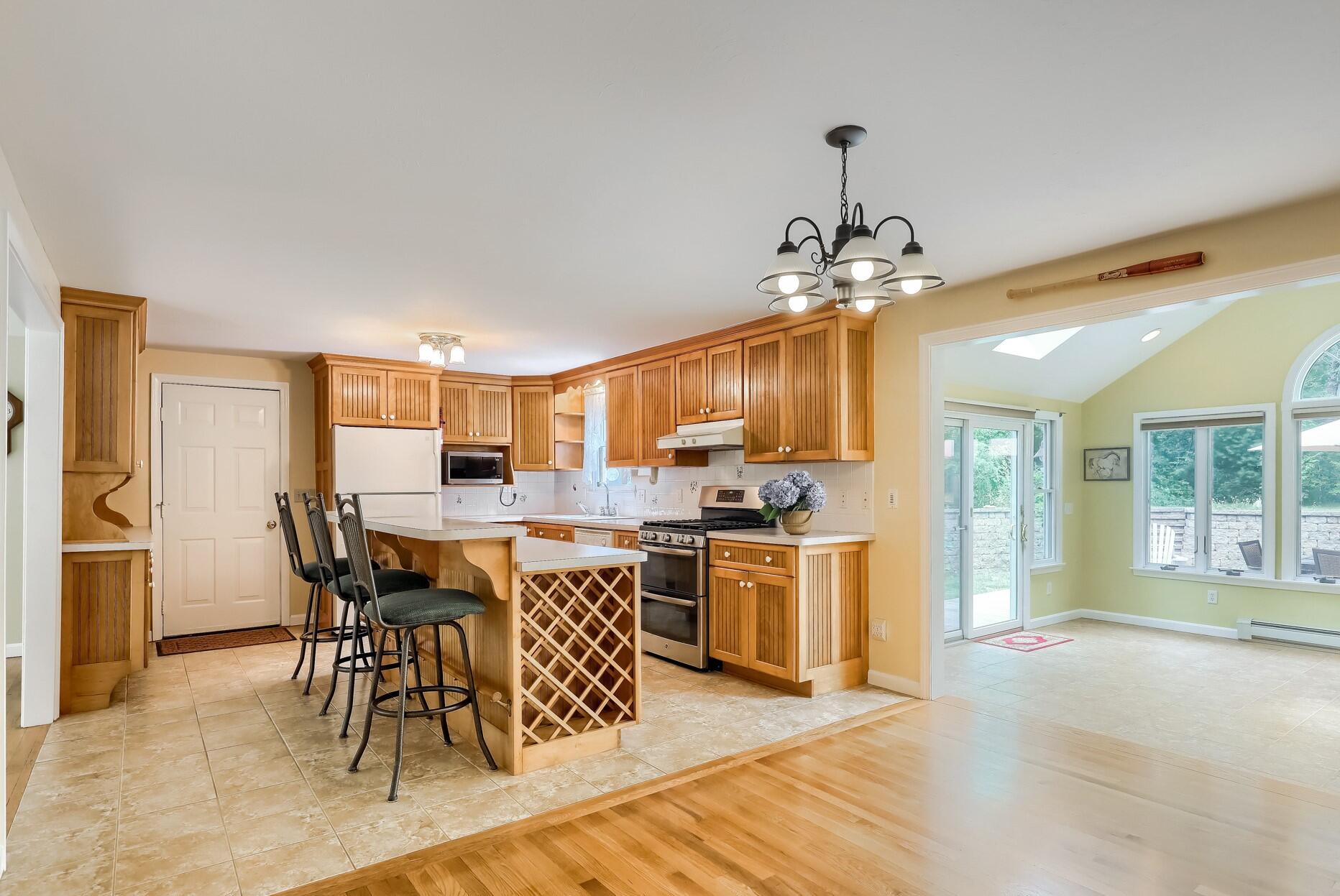 626 River Road Marstons Mills, MA 02648 - Photo 7 of 27 a view of a dining room with furniture window and wooden floor