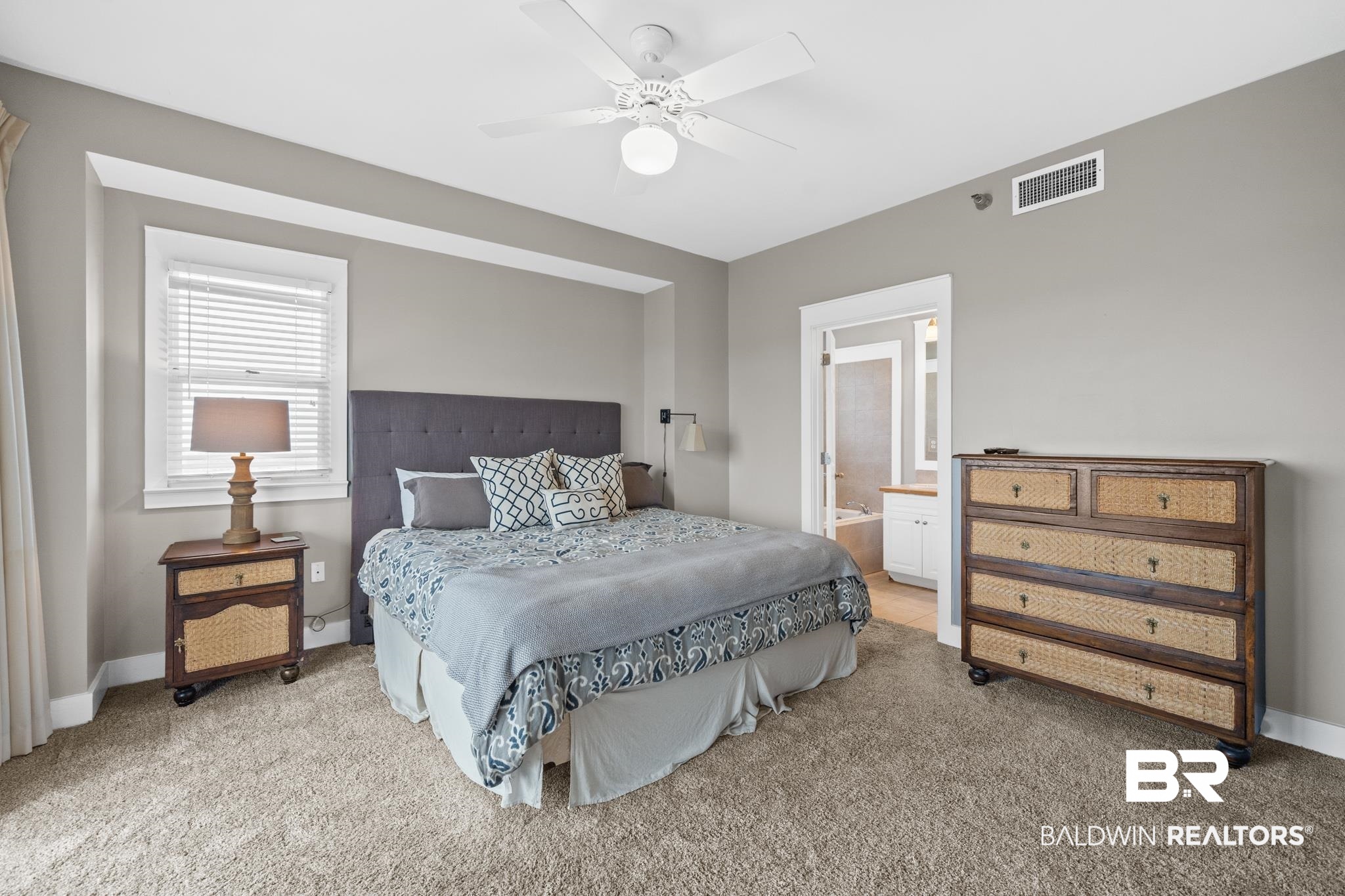 815 Plantation Road, Unit 405 Gulf Shores, AL 36542 - Photo 16 of 39 Carpeted bedroom featuring ceiling fan and ensuite bath