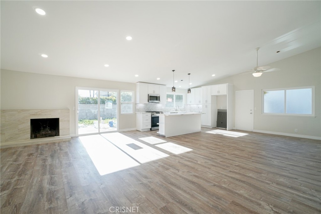 1108 Waltham Road Simi Valley, CA 93065 - Photo 11 of 25 a view of an empty room with a kitchen and a window