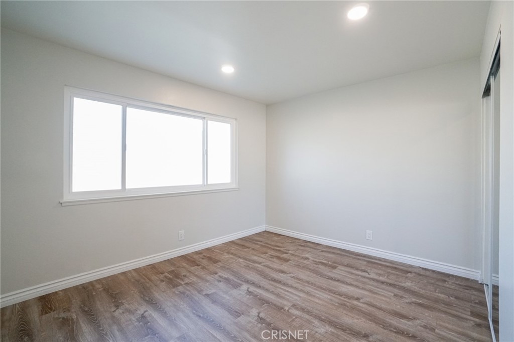 1108 Waltham Road Simi Valley, CA 93065 - Photo 15 of 25 wooden floor in an empty room with a window