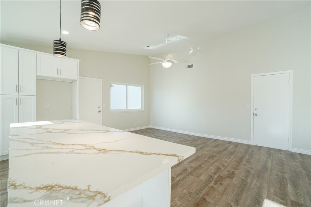 1108 Waltham Road Simi Valley, CA 93065 - Photo 18 of 25 a bedroom with a bed and a chandelier