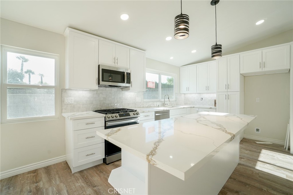 1108 Waltham Road Simi Valley, CA 93065 - Photo 2 of 25 a kitchen with a sink appliances and cabinets