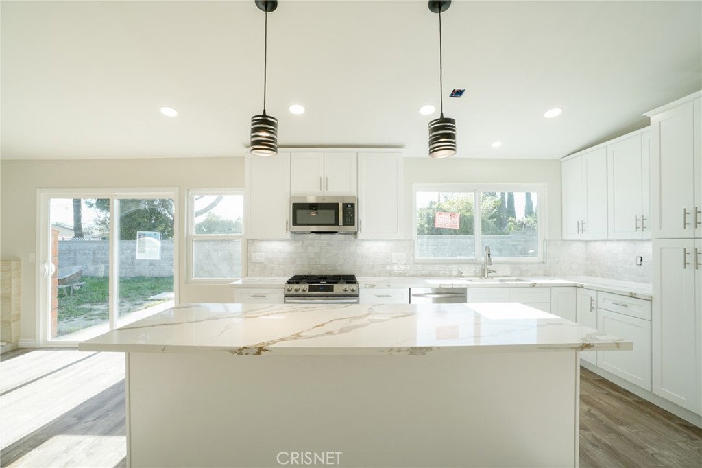 1108 Waltham Road Simi Valley, CA 93065 - Photo 3 of 25 a kitchen with appliances a sink and cabinets