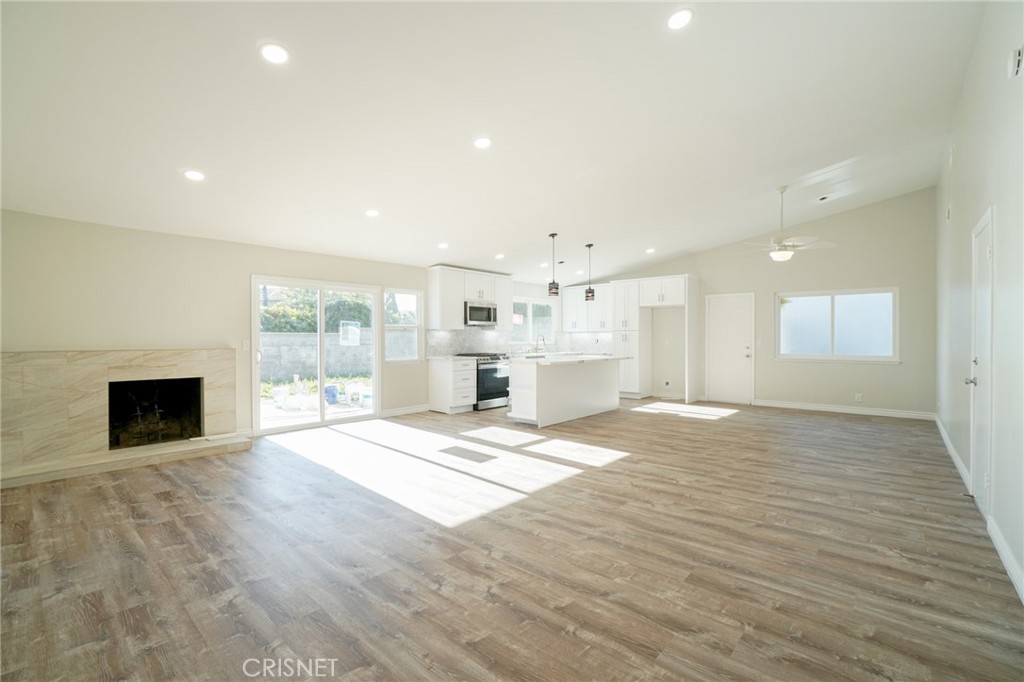 1108 Waltham Road Simi Valley, CA 93065 - Photo 5 of 25 a view of an empty room with a fireplace and a window