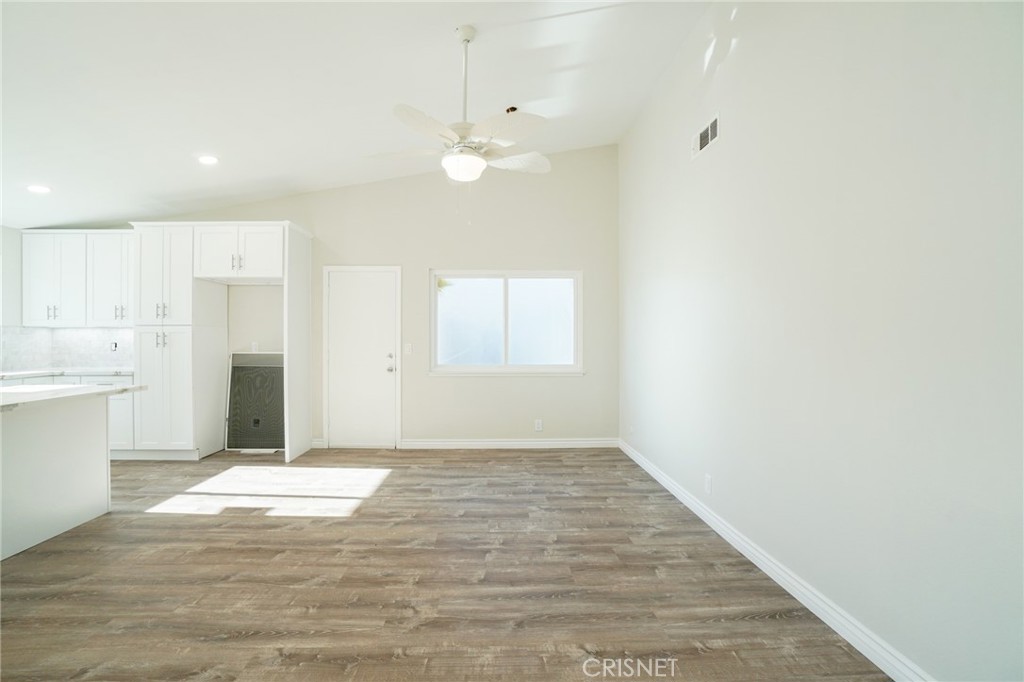 1108 Waltham Road Simi Valley, CA 93065 - Photo 10 of 25 a view of an empty room with window and wooden floor