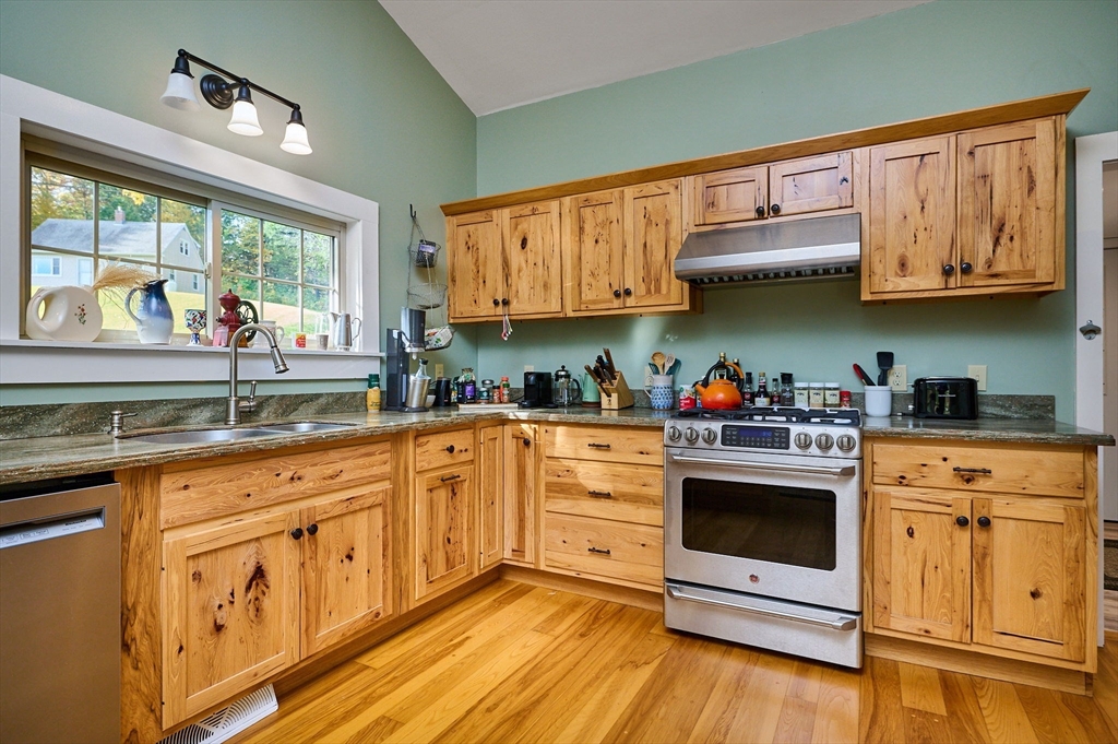 10 Walker Road Buckland, MA 01370 - Photo 8 of 41 a kitchen with granite countertop a stove top oven sink and cabinets