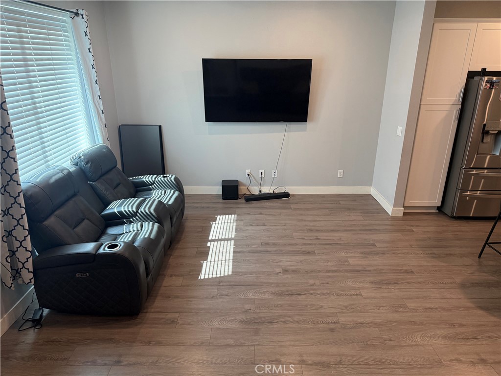 425 North Beechwood Avenue Rialto, CA 92376 - Photo 11 of 33 a living room with furniture and a flat screen tv