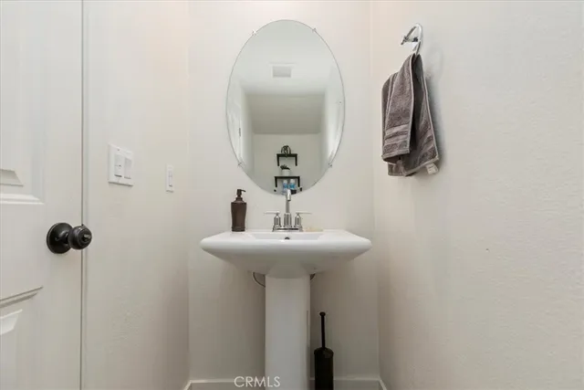 a bathroom with a sink and mirror