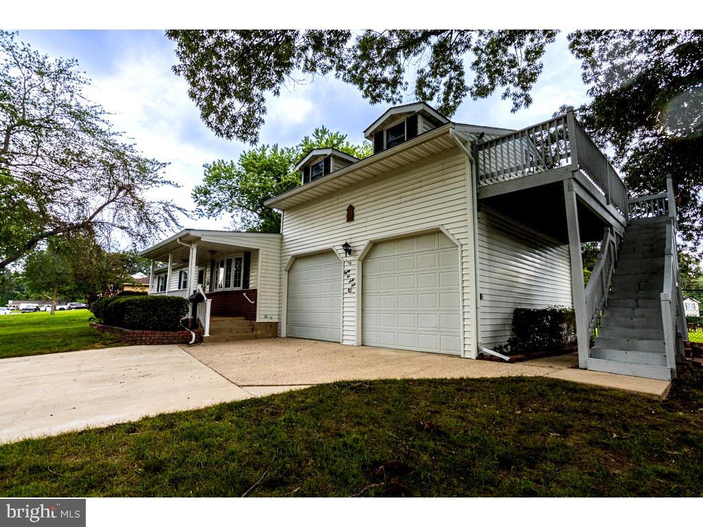 8261 Spring Knoll Drive Pasadena, MD 21122 - Photo 2 of 49 a view of house with yard and outdoor seating