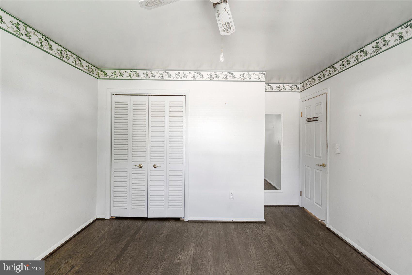 8261 Spring Knoll Drive Pasadena, MD 21122 - Photo 21 of 49 a view of a livingroom with wooden floor