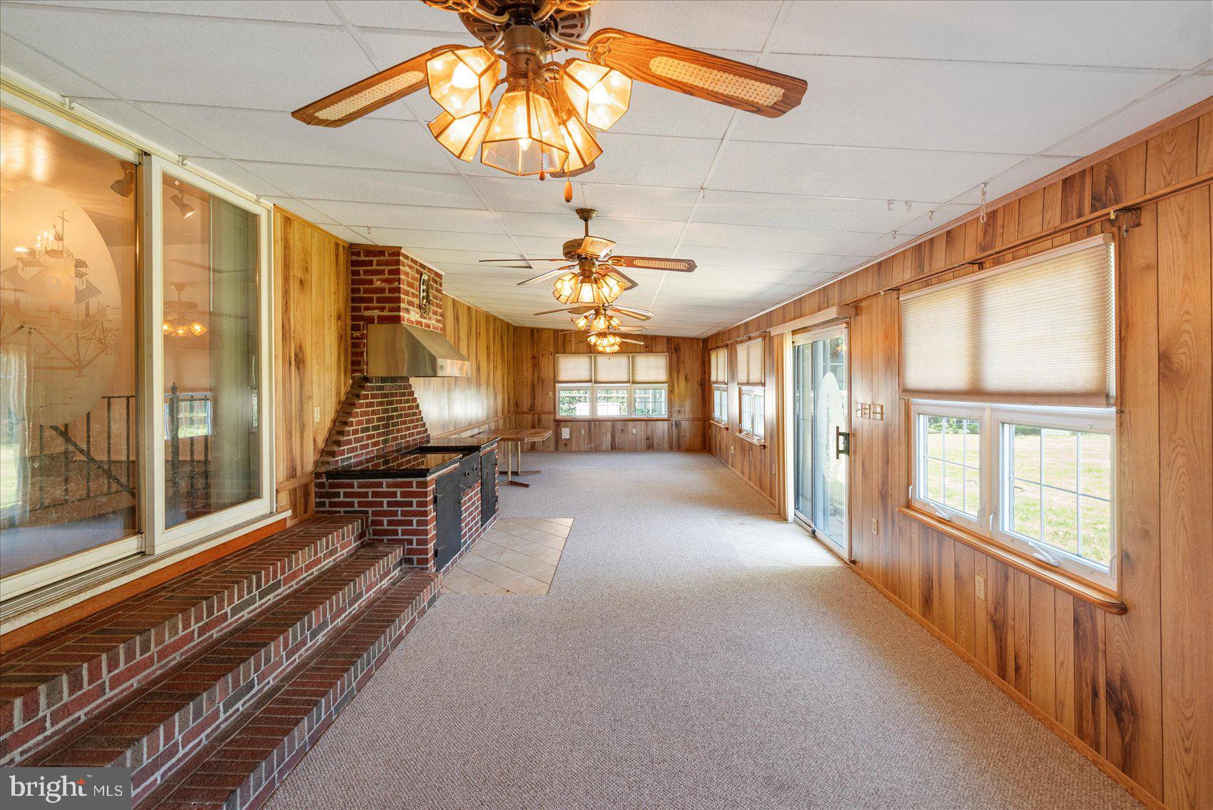8261 Spring Knoll Drive Pasadena, MD 21122 - Photo 24 of 49 a view of a room with window and chandelier