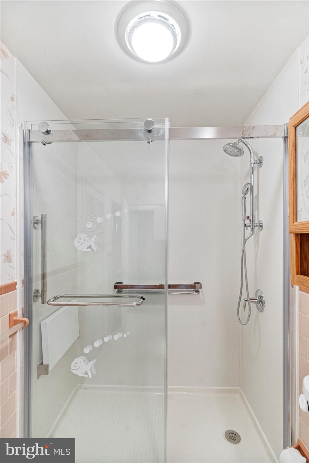 8261 Spring Knoll Drive Pasadena, MD 21122 - Photo 28 of 49 a bathroom with a shower