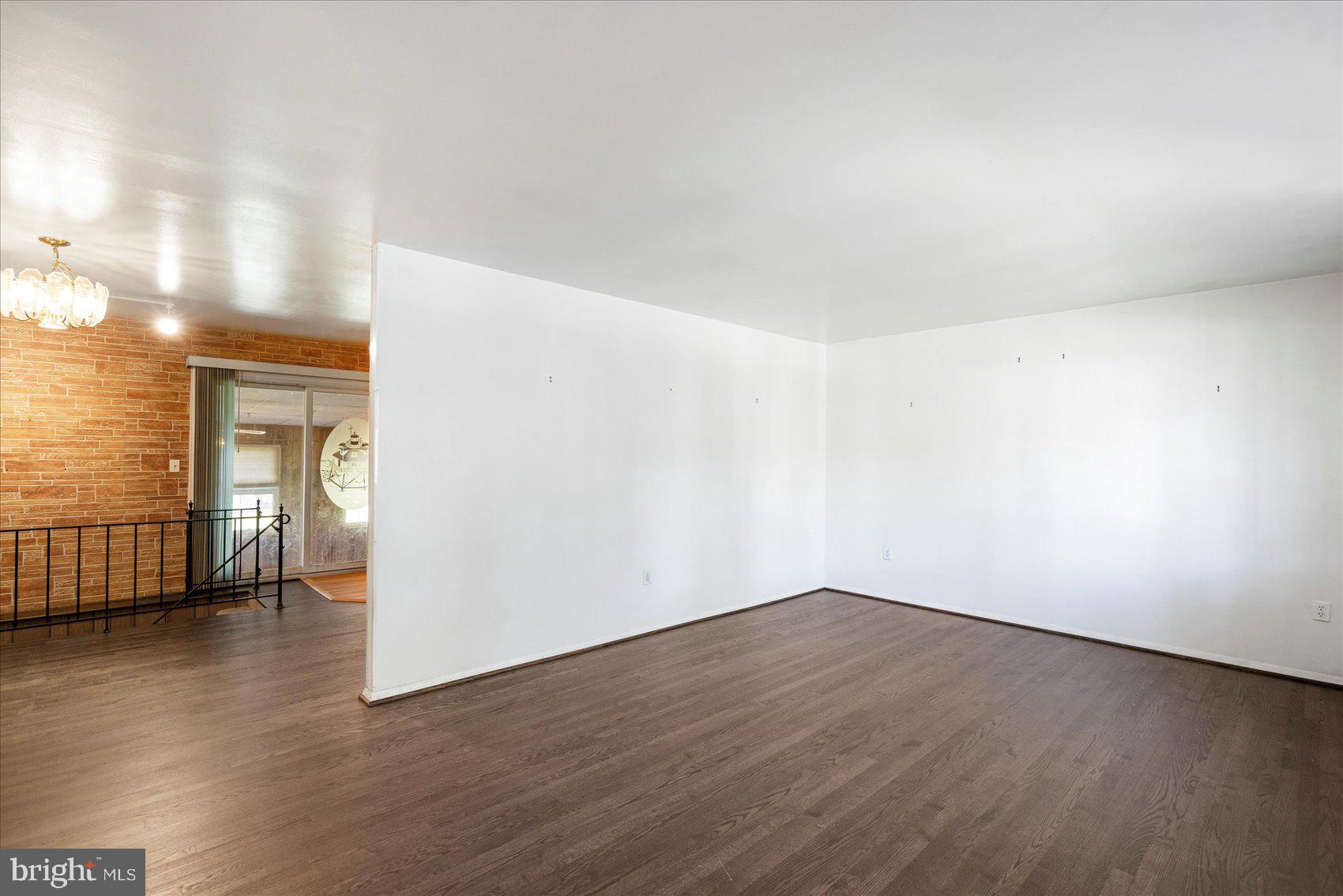 8261 Spring Knoll Drive Pasadena, MD 21122 - Photo 10 of 49 a view of a room with wooden floor