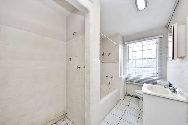 a bathroom with a sink a toilet and a bathtub