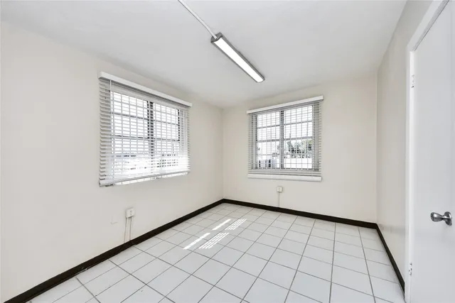 a view of an empty room and window