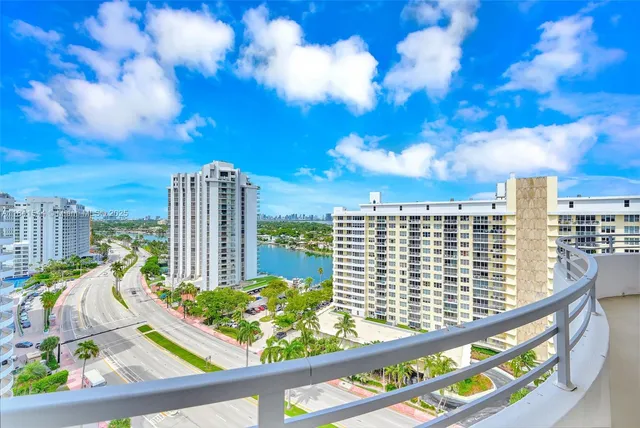 a view of a kitchen with stainless steel appliances granite countertop a sink and cabinets