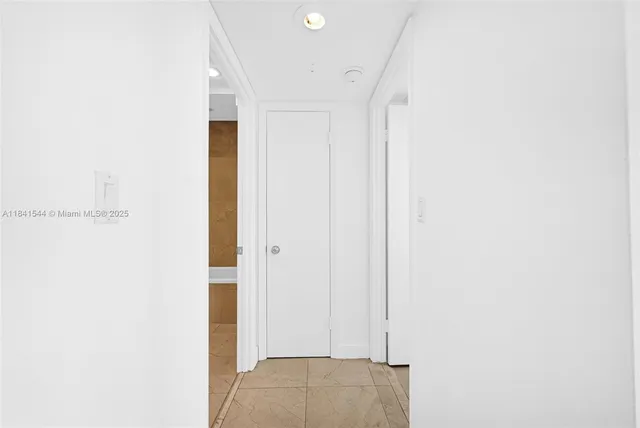 a bathroom with a sink a toilet a mirror and a bathtub