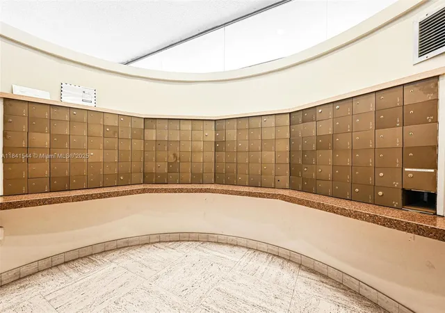 a view of living room filled with furniture and flowers