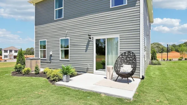 a view of backyard with a garden and entertaining space