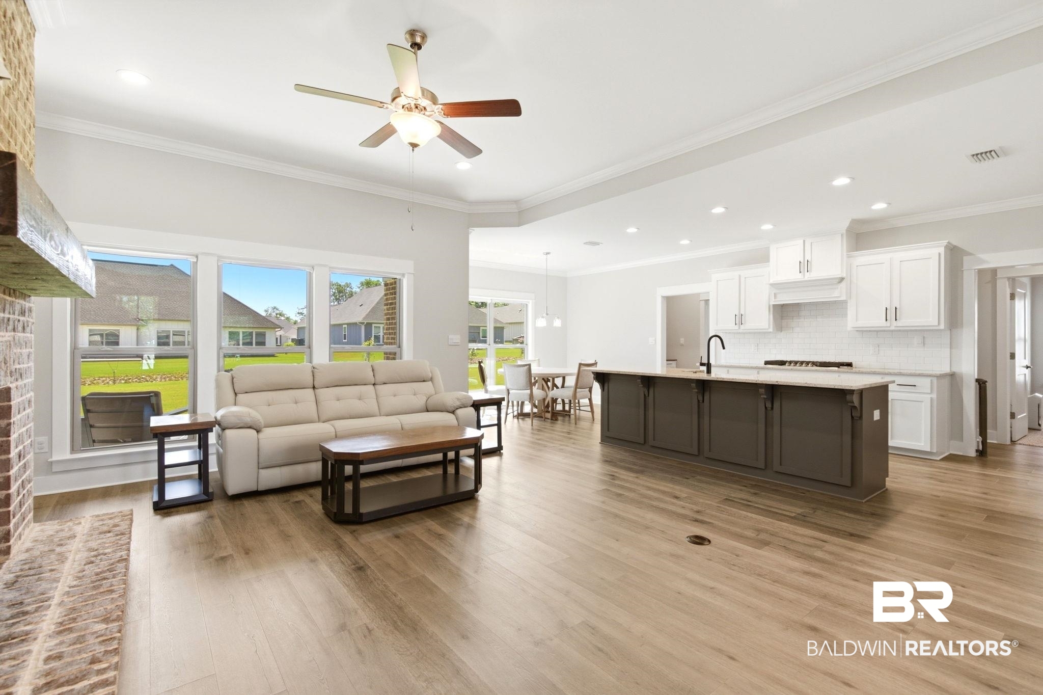 12132 Exbury Way Daphne, AL 36527 - Photo 6 of 47 Living room with crown molding, ceiling fan, light wood-style floors, recessed lighting, and a residential view