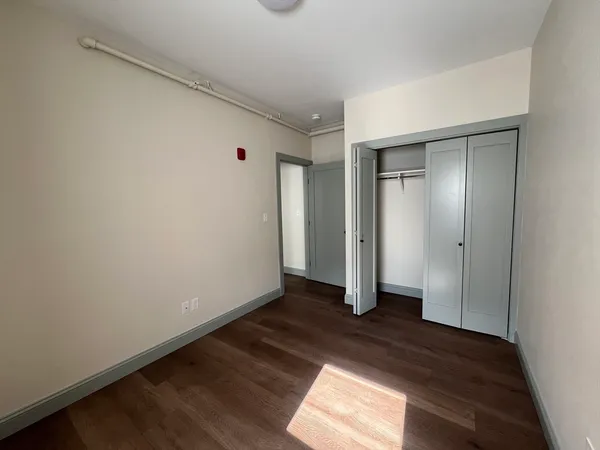 a view of wooden floor in an empty room