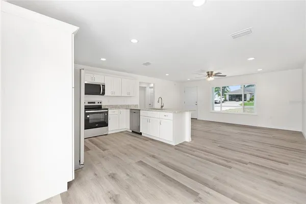 a view of kitchen with wooden floor