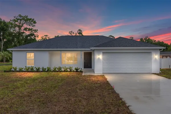 front view of a house with a yard