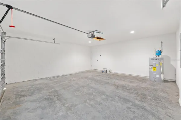 a view of a storage & utility room with two washing machine