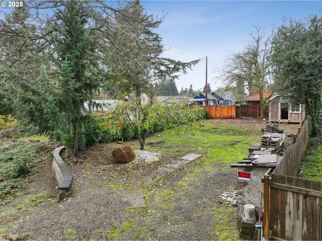 a view of a park with iron fence