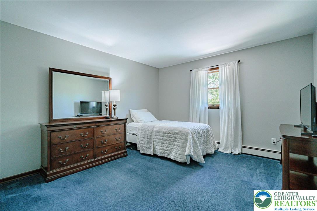 3857 Friedens Road Slatington, PA 18080 - Photo 42 of 75 This cozy bedroom offers a tranquil retreat with soft lighting and ample natural light.