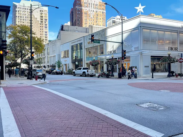 a group of people sitting in front of building