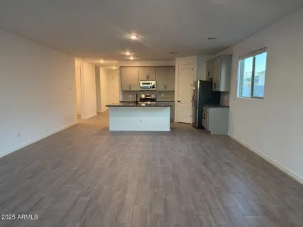 a bathroom with double sink and a mirror