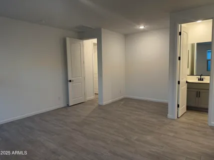 a picture of a bench in front of a wall