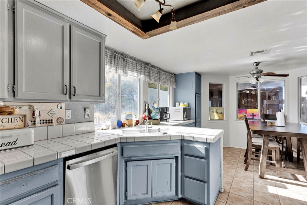 6414 Nielson Road Phelan, CA 92371 - Photo 21 of 74 a kitchen with a sink stove and cabinets