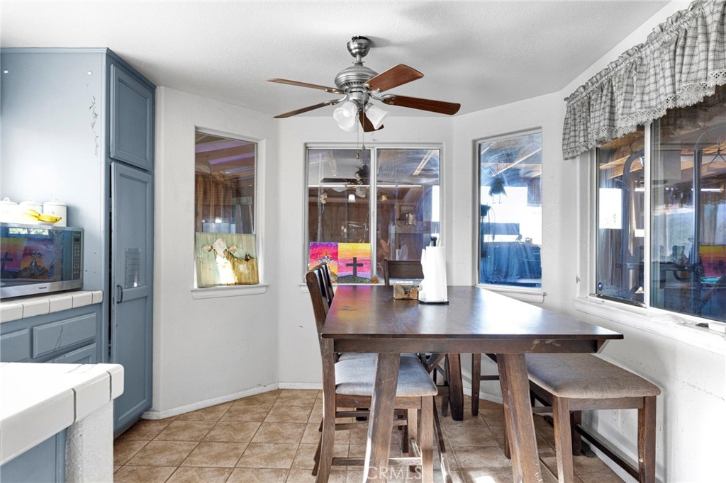 6414 Nielson Road Phelan, CA 92371 - Photo 27 of 74 a dining room with furniture and window