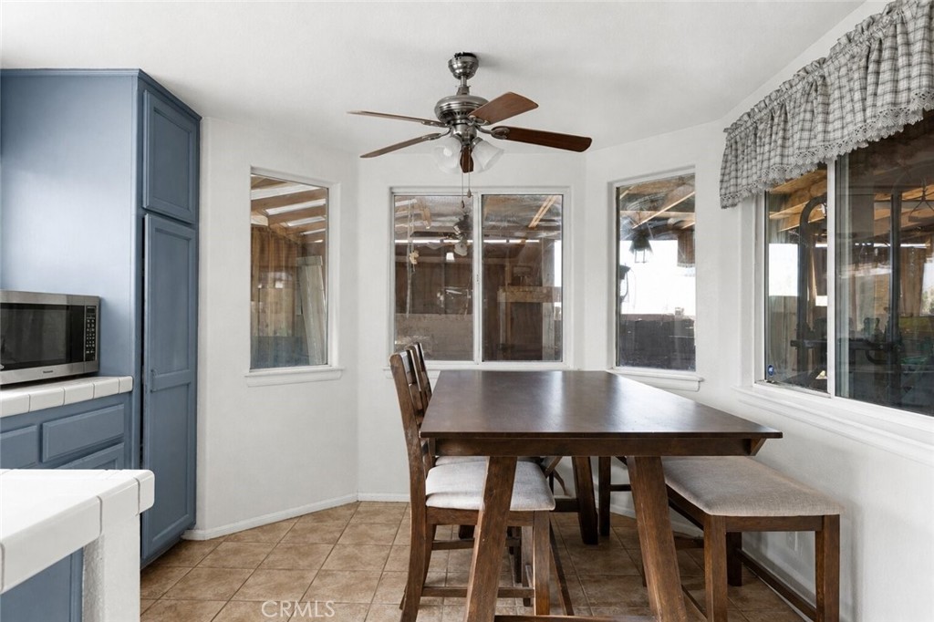 6414 Nielson Road Phelan, CA 92371 - Photo 28 of 74 a view of a dining room with a table and chairs