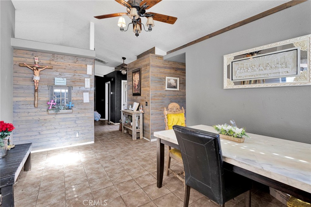6414 Nielson Road Phelan, CA 92371 - Photo 31 of 74 a view of a dining room with furniture and a chandelier