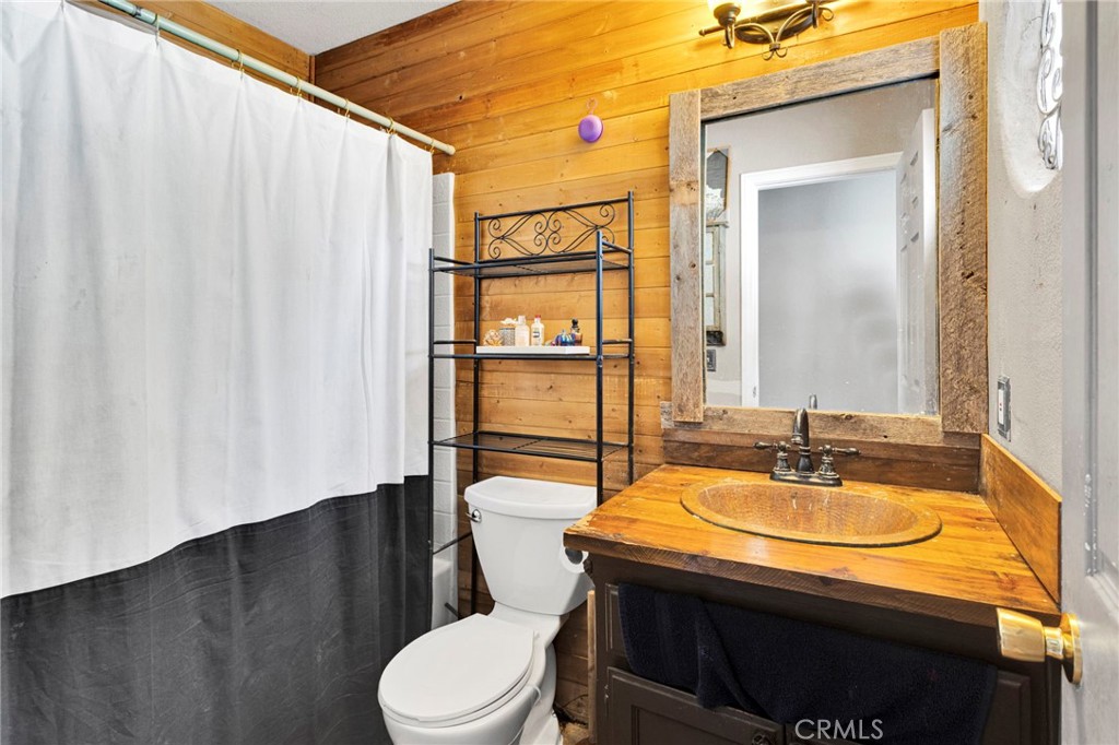 6414 Nielson Road Phelan, CA 92371 - Photo 36 of 74 a bathroom with a sink and a mirror
