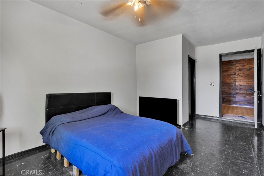 6414 Nielson Road Phelan, CA 92371 - Photo 37 of 74 a bedroom with a bed and a chandelier