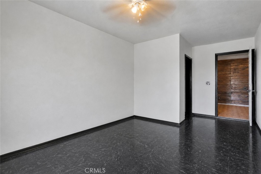 6414 Nielson Road Phelan, CA 92371 - Photo 38 of 74 an empty room with wooden floor and closet