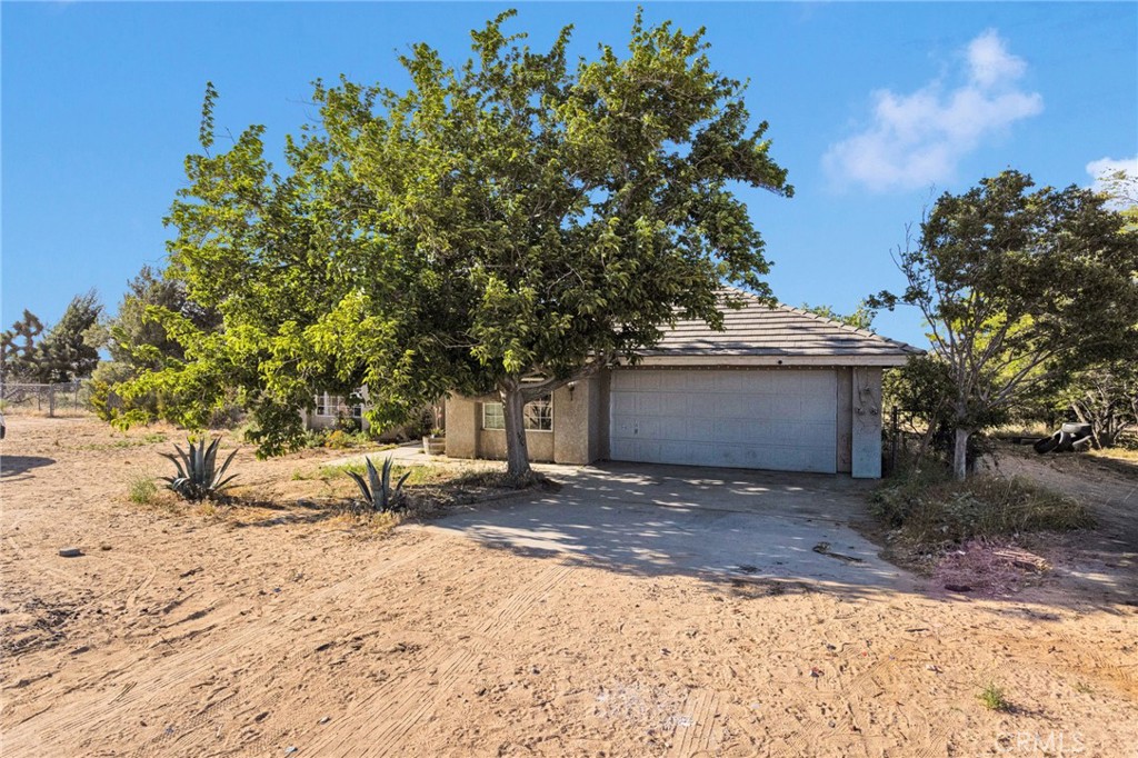 6414 Nielson Road Phelan, CA 92371 - Photo 4 of 74 a view of a house with a tree