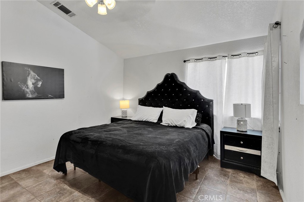 6414 Nielson Road Phelan, CA 92371 - Photo 44 of 74 a bedroom with a bed and a window
