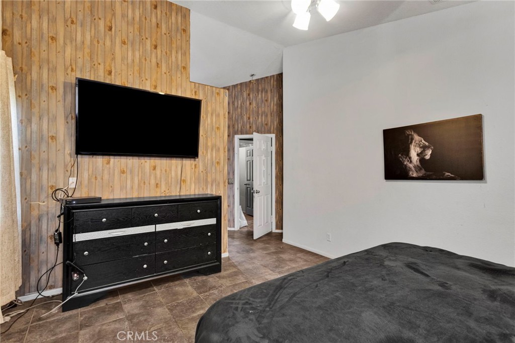 6414 Nielson Road Phelan, CA 92371 - Photo 45 of 74 a bedroom with a bed and a flat screen tv