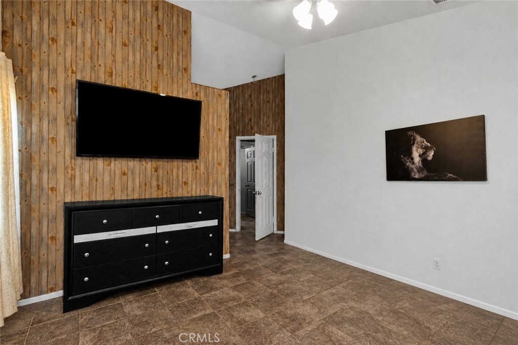 6414 Nielson Road Phelan, CA 92371 - Photo 46 of 74 a living room with a flat screen tv and a fireplace