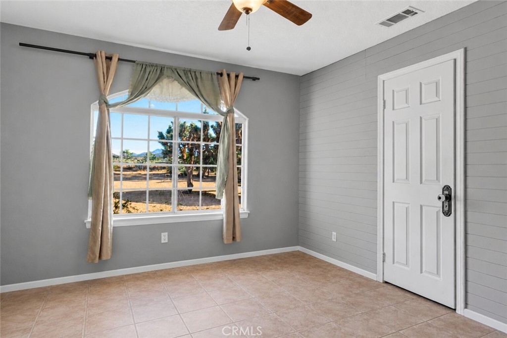 6414 Nielson Road Phelan, CA 92371 - Photo 50 of 74 an empty room that has a window and kitchen view