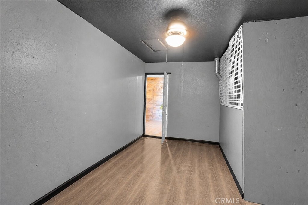 6414 Nielson Road Phelan, CA 92371 - Photo 56 of 74 wooden floor in an empty room with a window